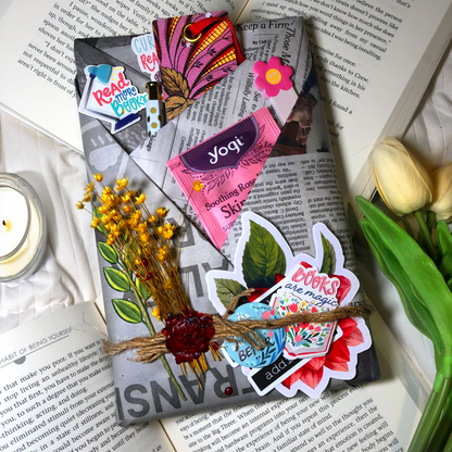 Vintage style Novel encounter wrapped in newspaper, on a bed with open books, tulips, and a candle