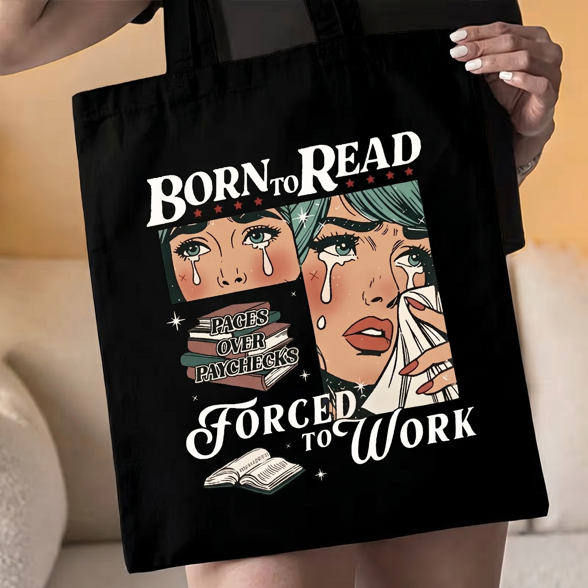Black tote bag being held at waist level