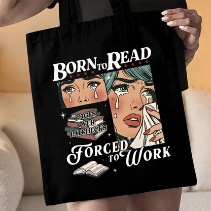Black tote bag being held at waist level