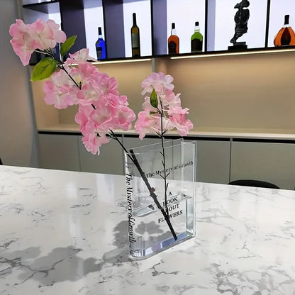 book vase sitting on a white marble dining table with flowers inside