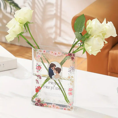 book vase with roses and water inside sitting on a coffee table